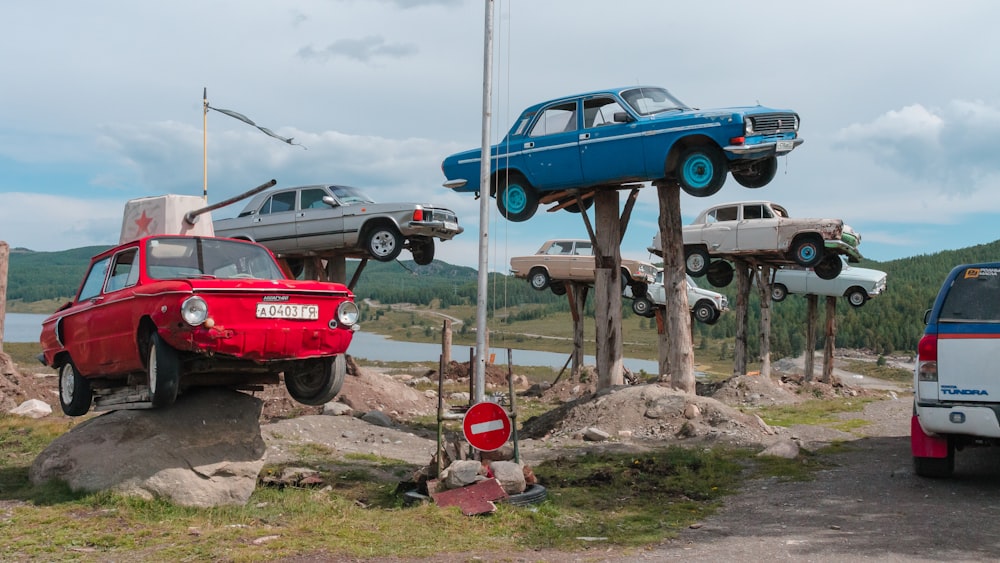 a group of cars parked on a rocky hill
