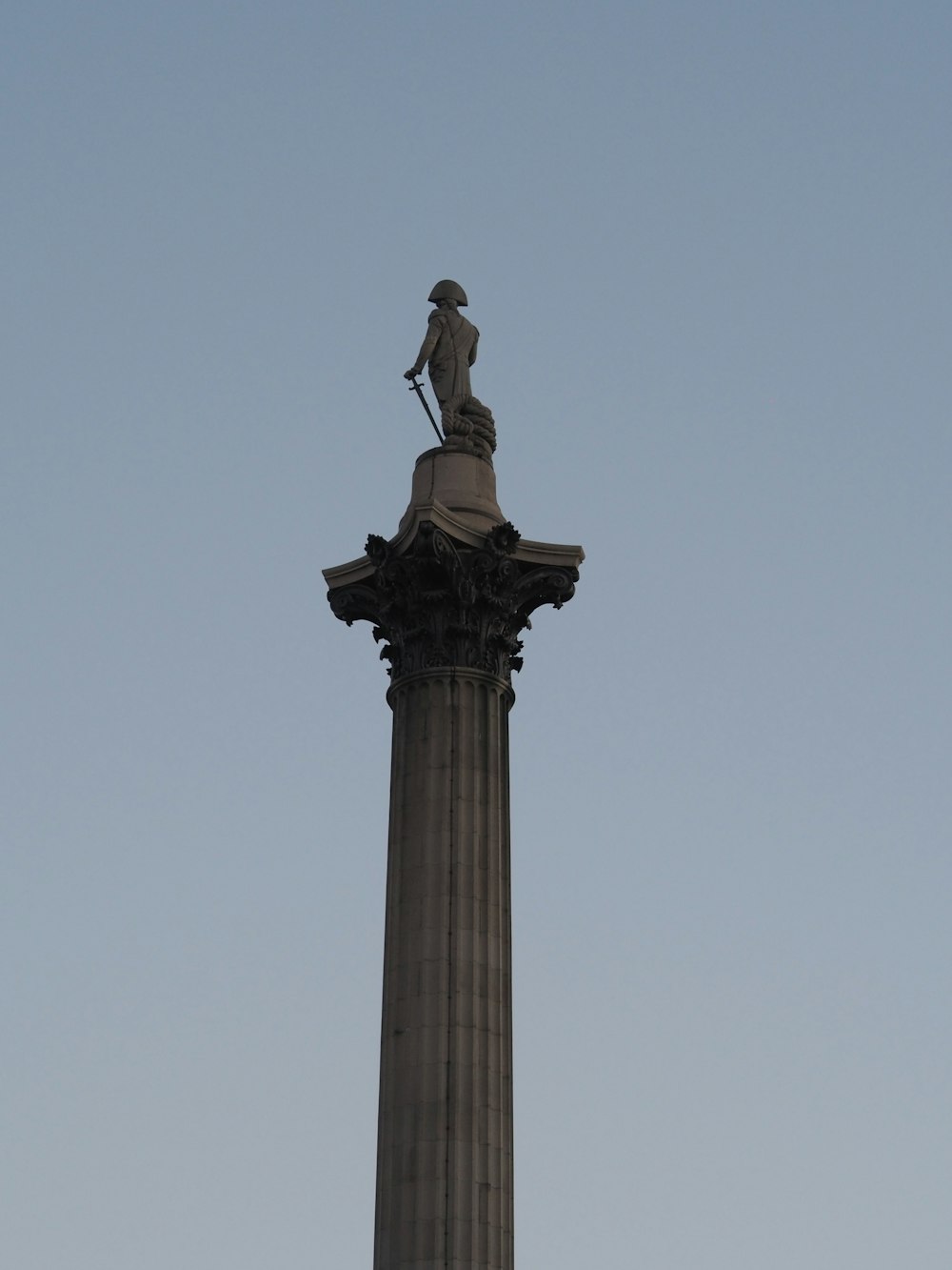 a statue on a pillar