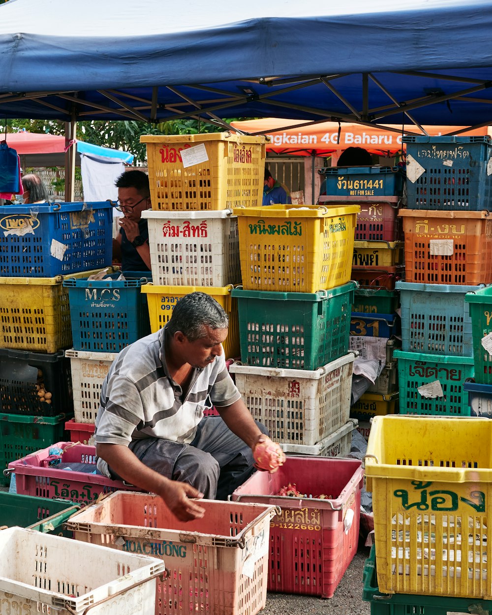 a person sitting in a market