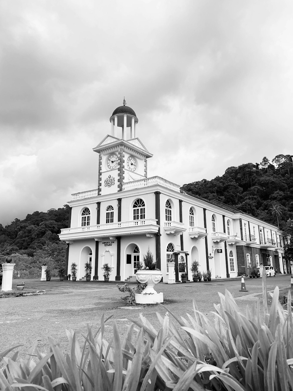 a white building with a clock tower