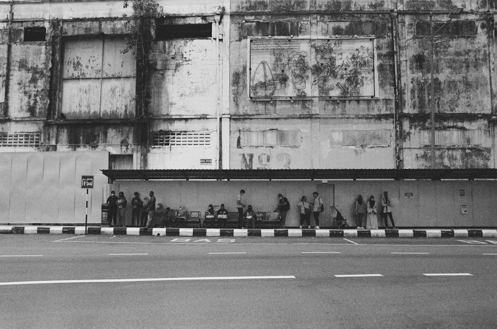 a group of people standing outside a building