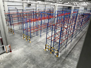 a large room with blue and yellow bars