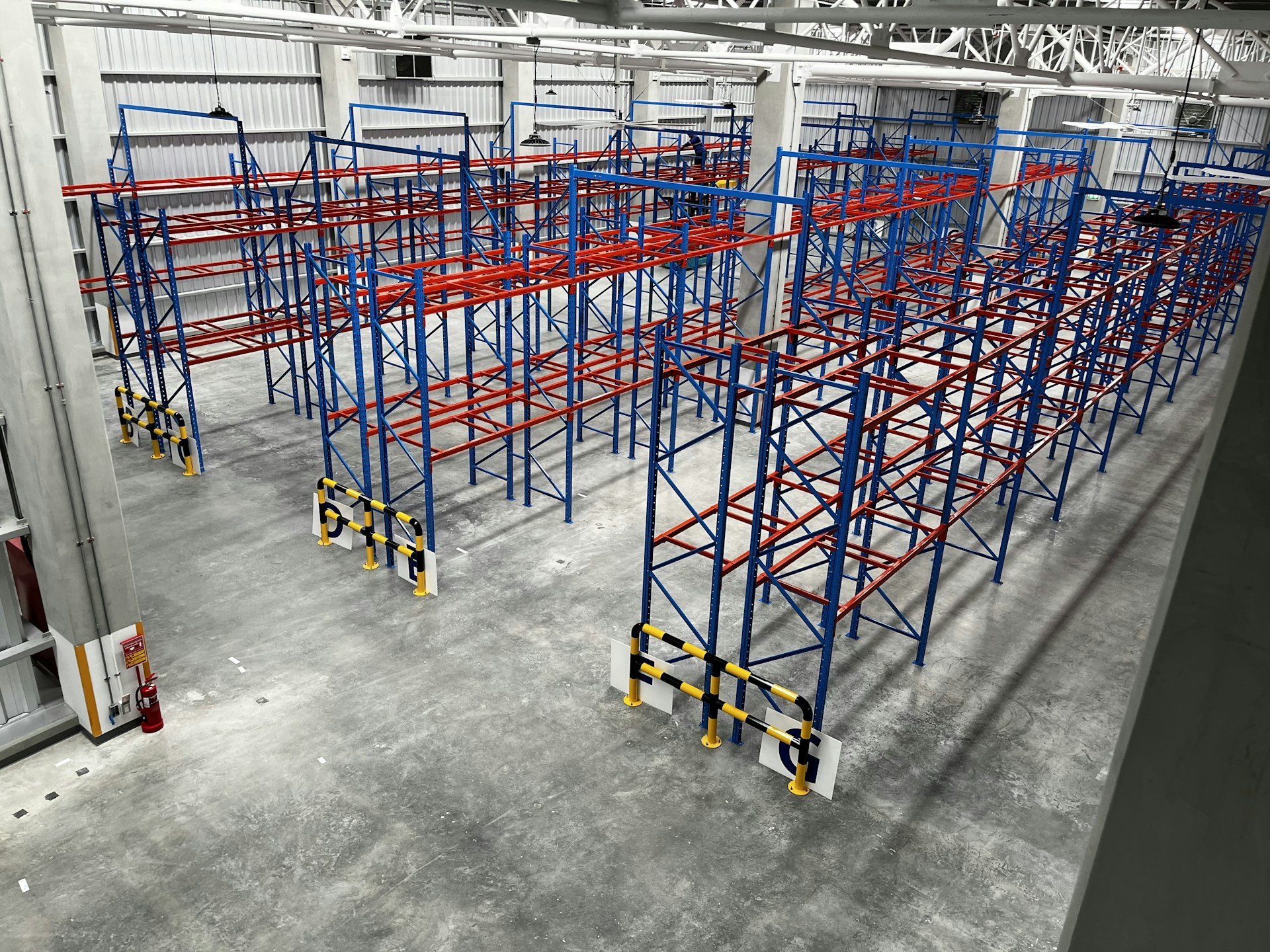 a large room with blue and yellow bars