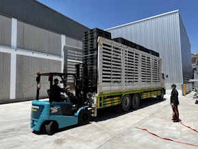 a person loading a large truck