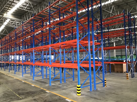 a warehouse with blue and yellow poles