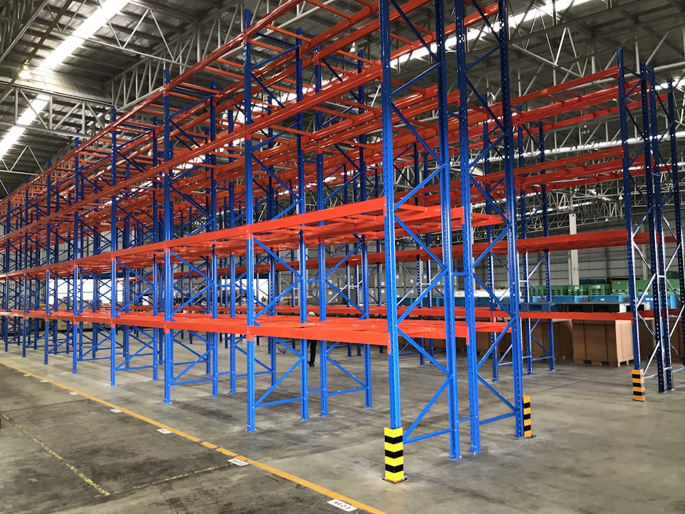 a warehouse with blue and yellow poles