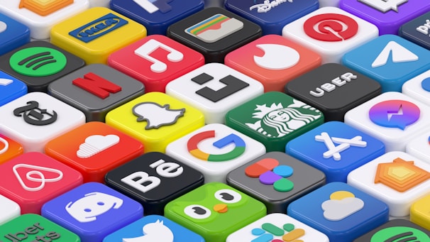 A collection of colorful 3D app icons arranged in a grid-like pattern, featuring well-known brands and services such as Spotify, Netflix, Discord, and Facebook. Each icon is distinct with vibrant colors and recognizable logos, giving a sense of modern digital culture.