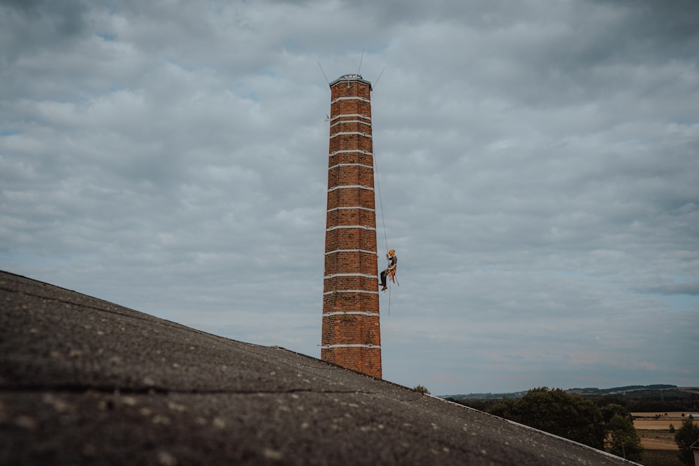 a tower with a person standing on it