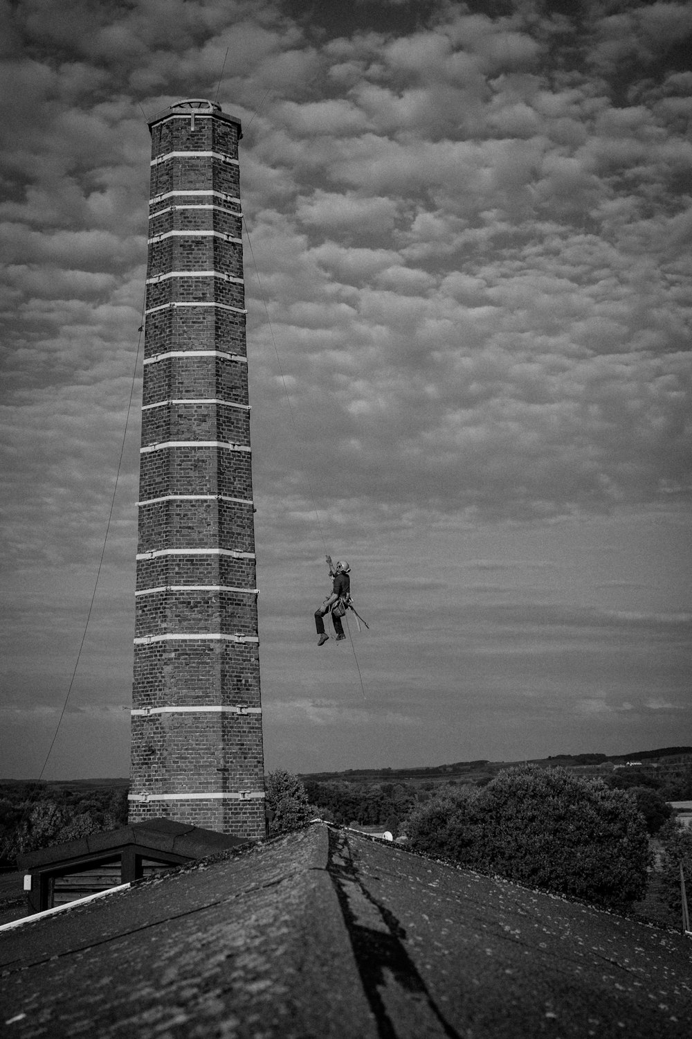 a person jumping off a tall tower