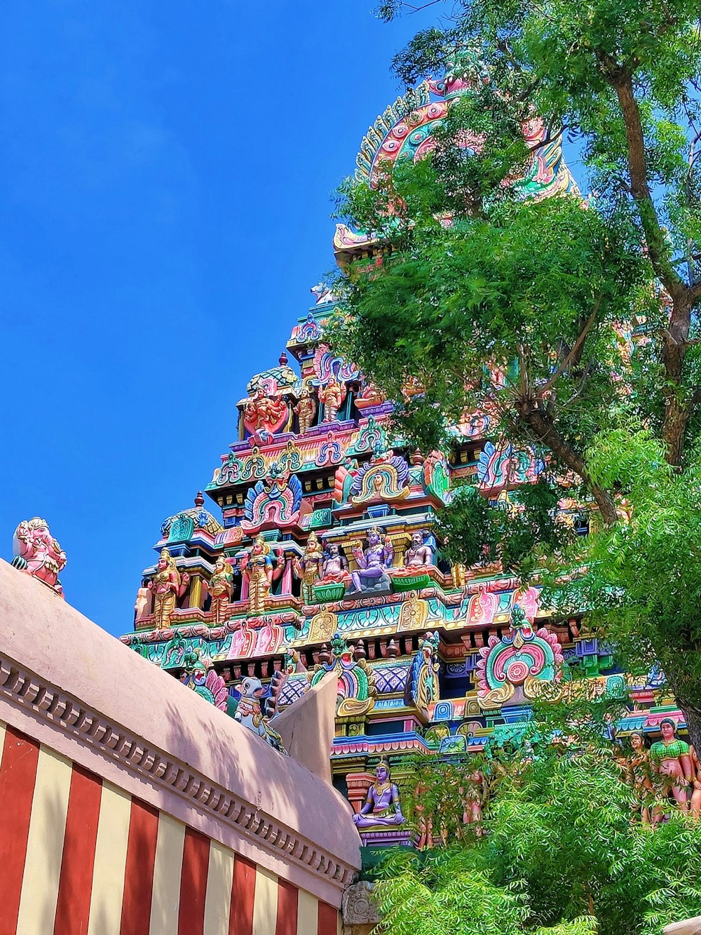 a colorful building with a tree in the front