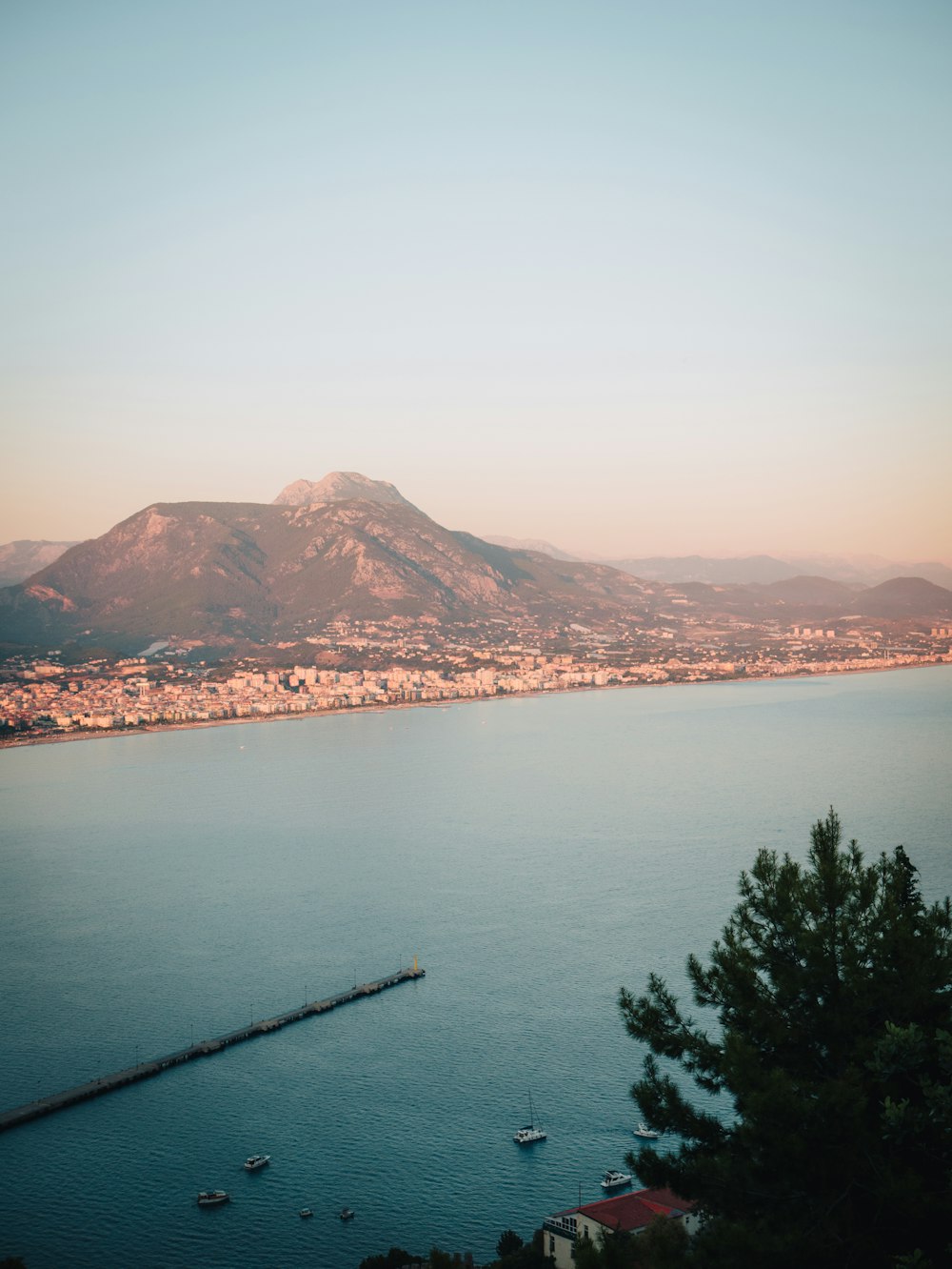 a body of water with mountains in the background