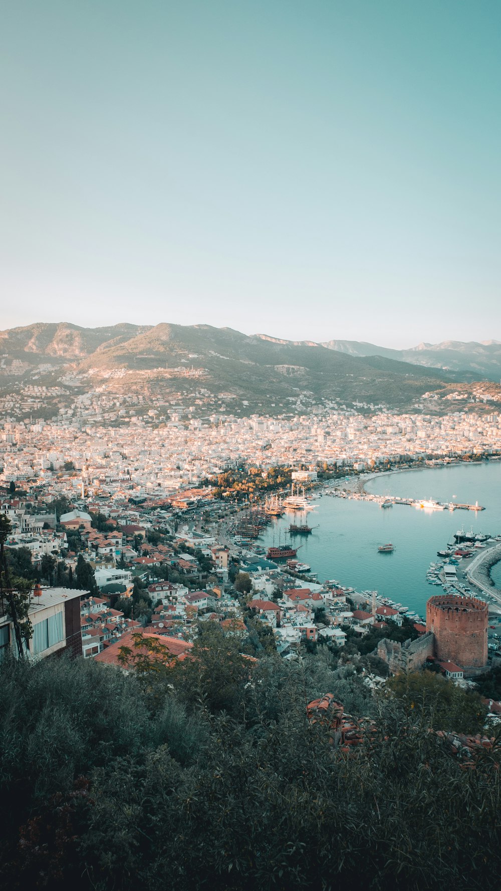 a city with many buildings and boats