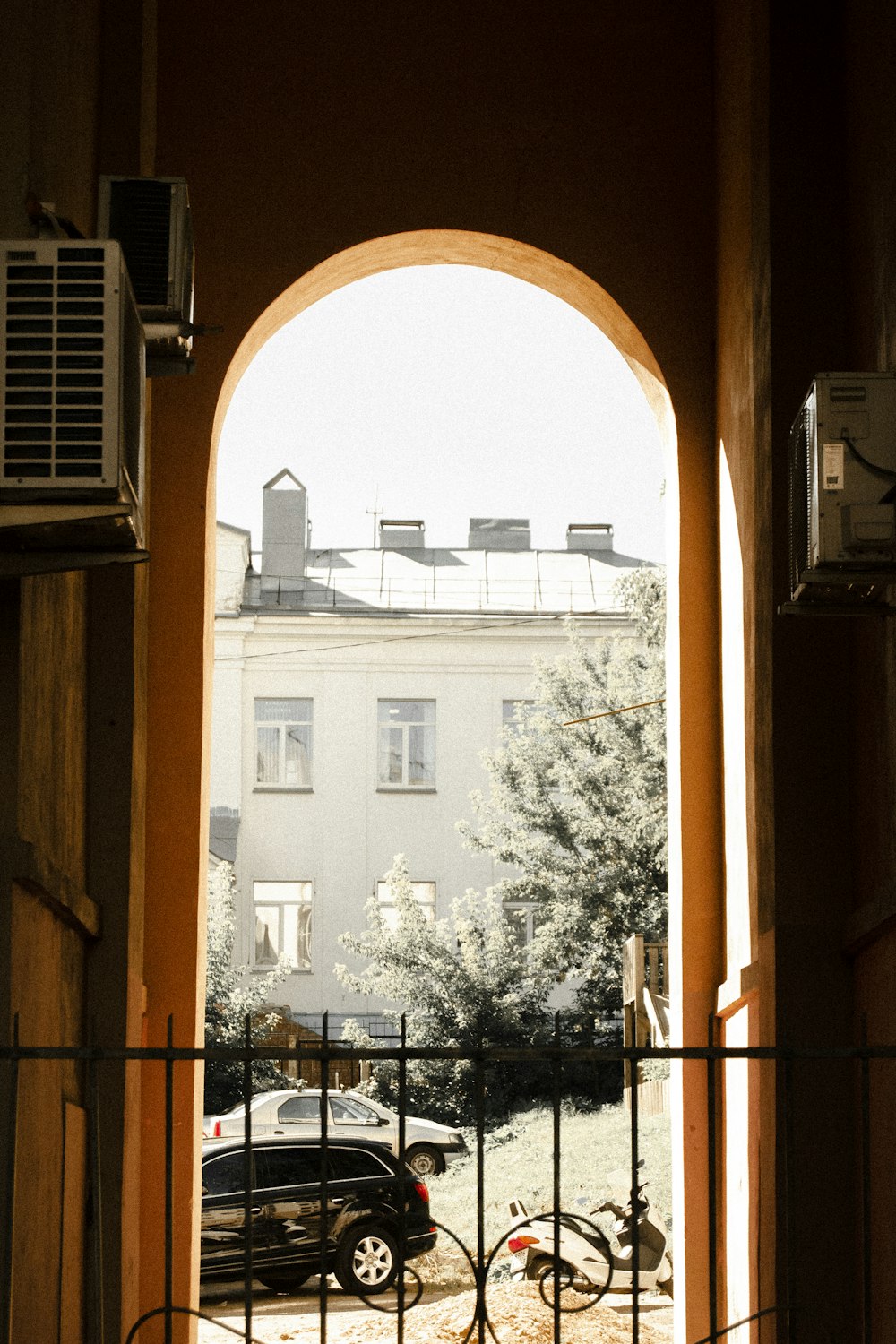 a view of a street through a window of a building
