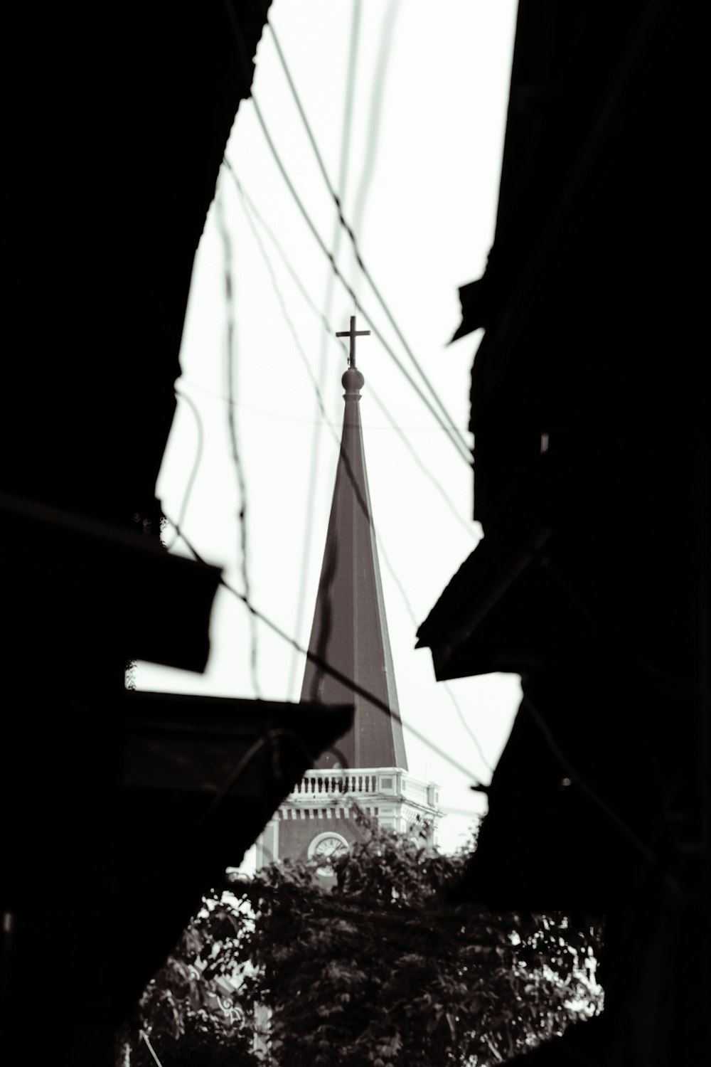 a church steeple with a cross on top