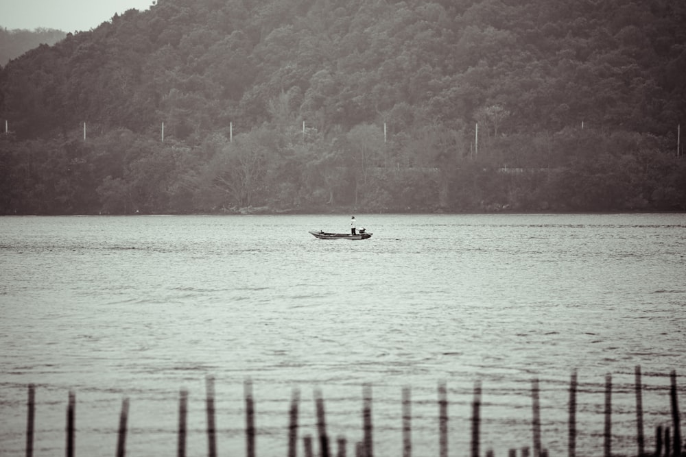 a person in a boat on a lake