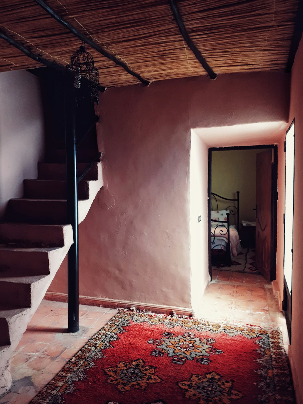 a staircase with a rug