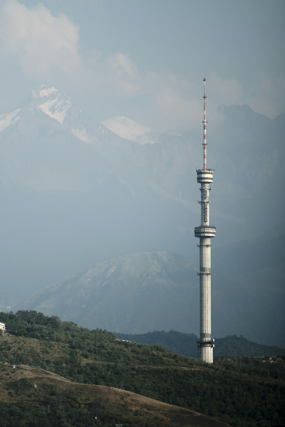 a tall tower on a hill