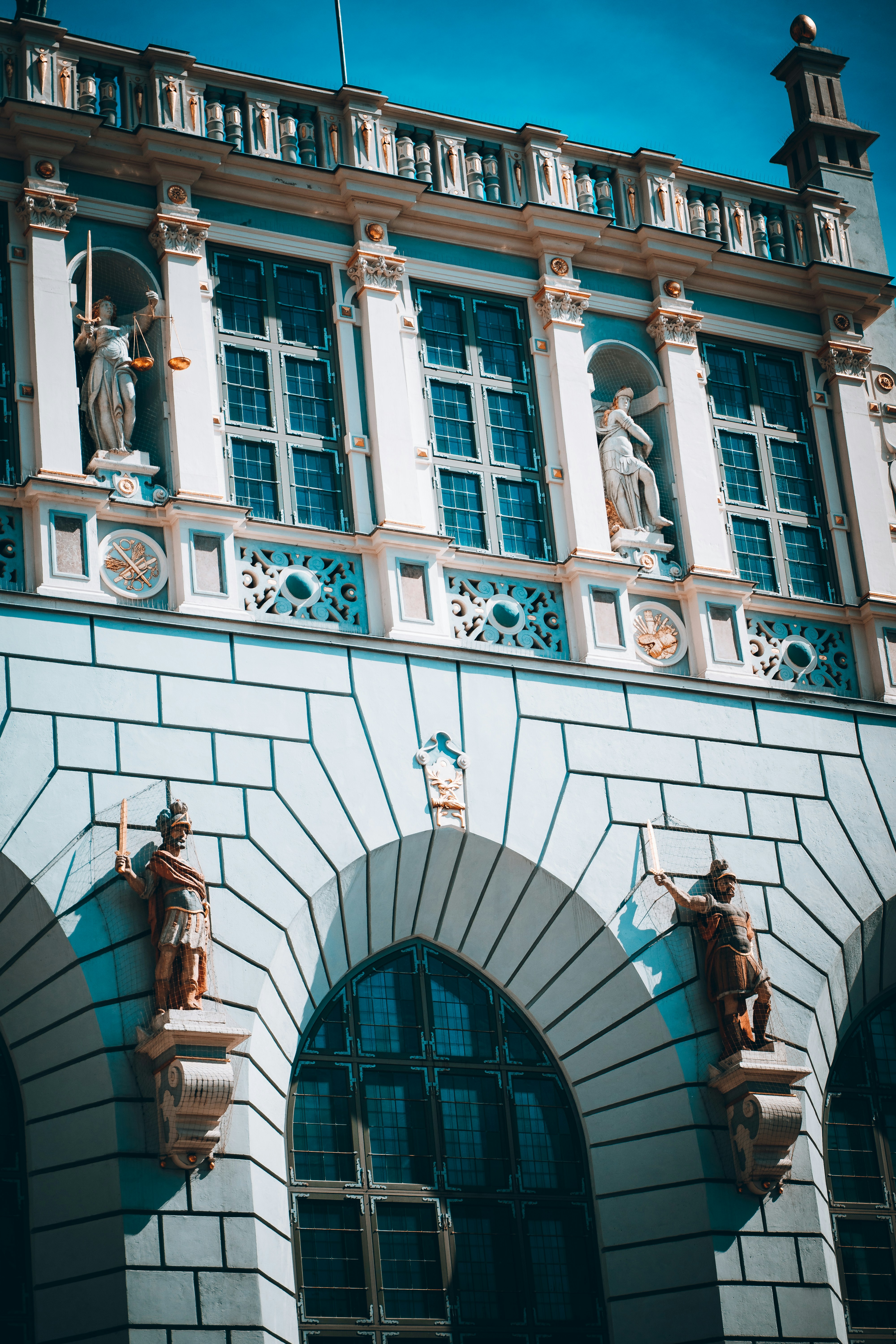 a building with statues on the front