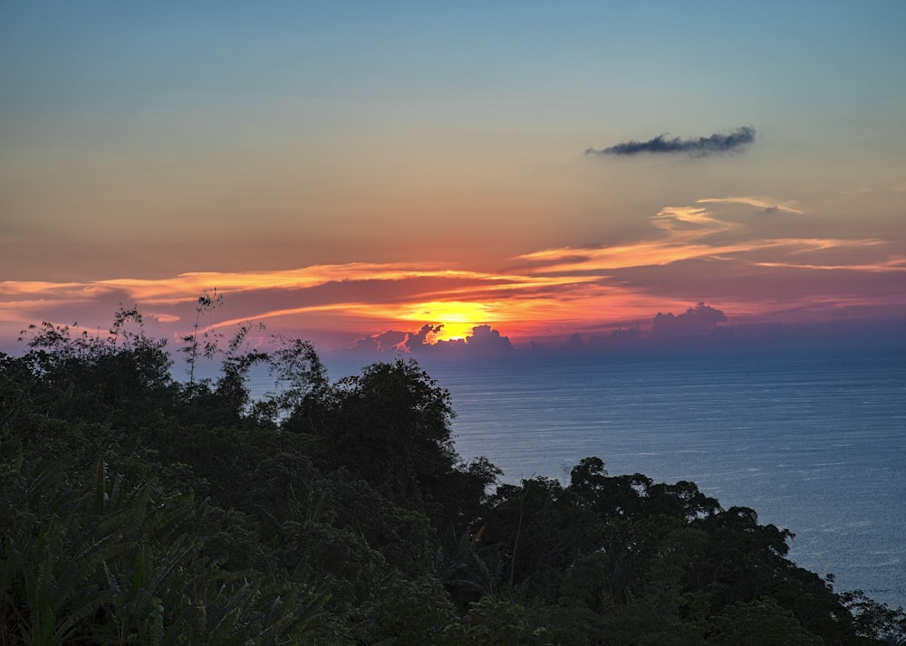 a sunset over a body of water