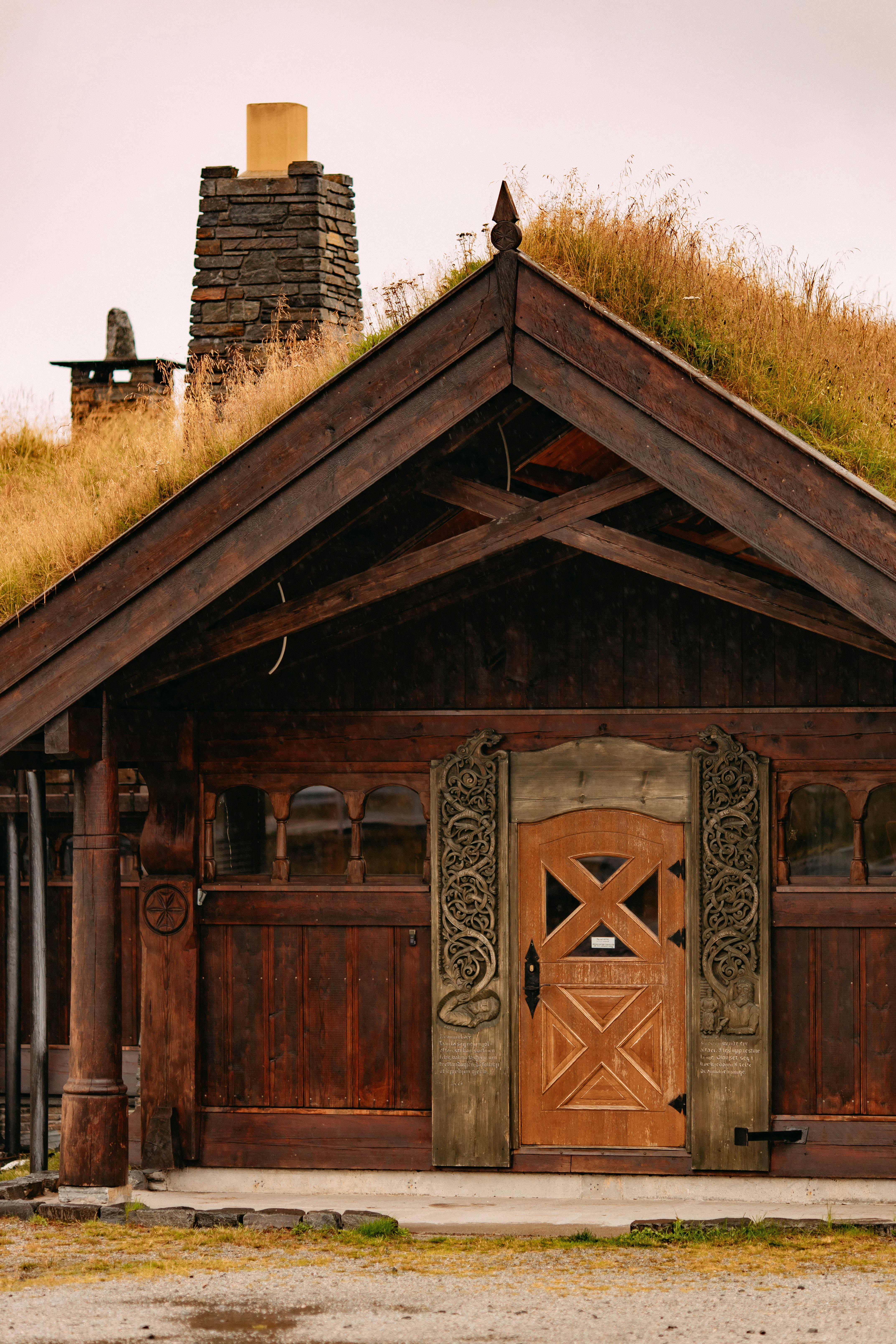 a wood building with a fence around it