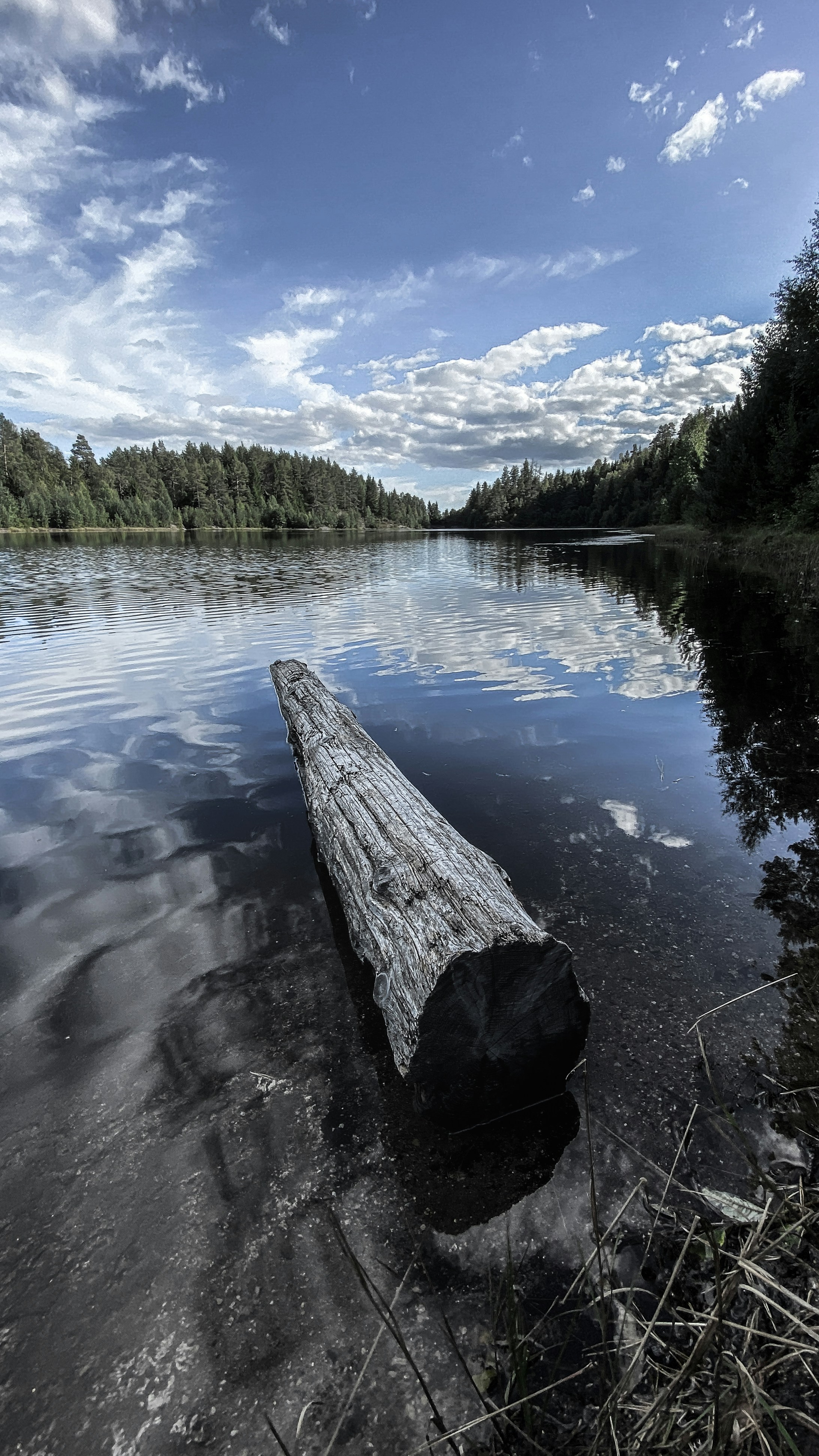 a large rock in a lake