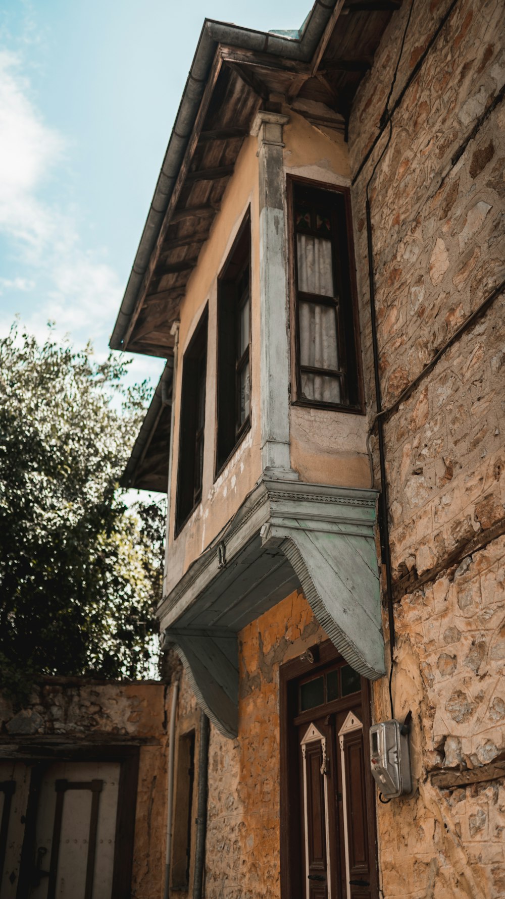 a building with a tree in the background