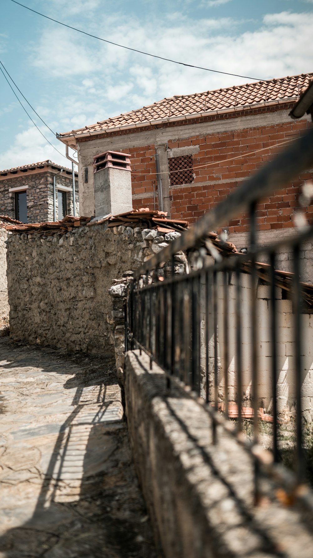 a brick building with a fence