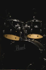 Various drum accessories including hardware and cymbals.