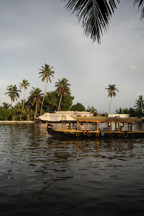 Traditional kettuvallam houseboat on Vembanad Lake, Kerala backwaters