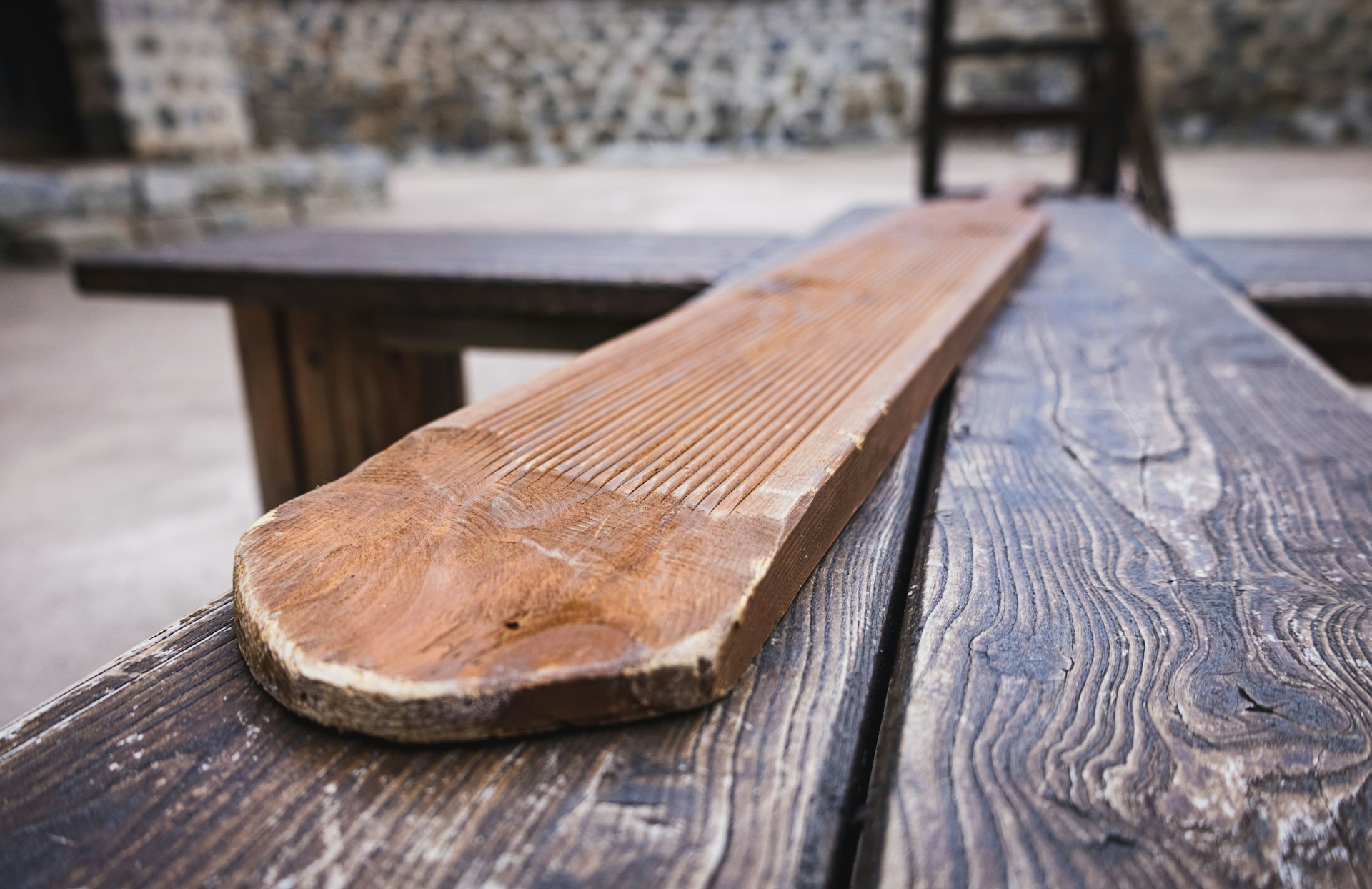 a wooden bench on a wood table