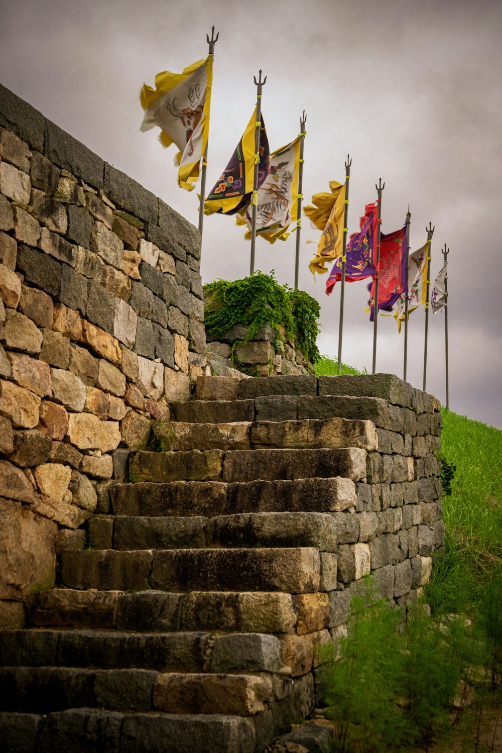 a stone staircase with flags on it