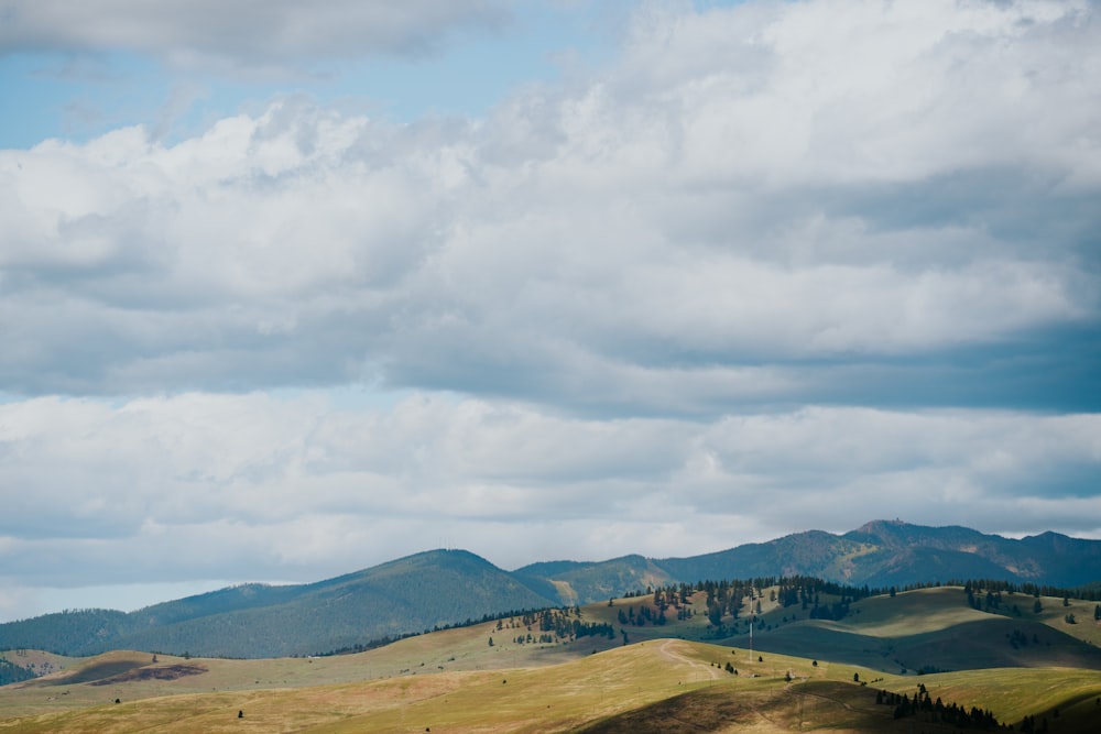 a landscape with hills and a town