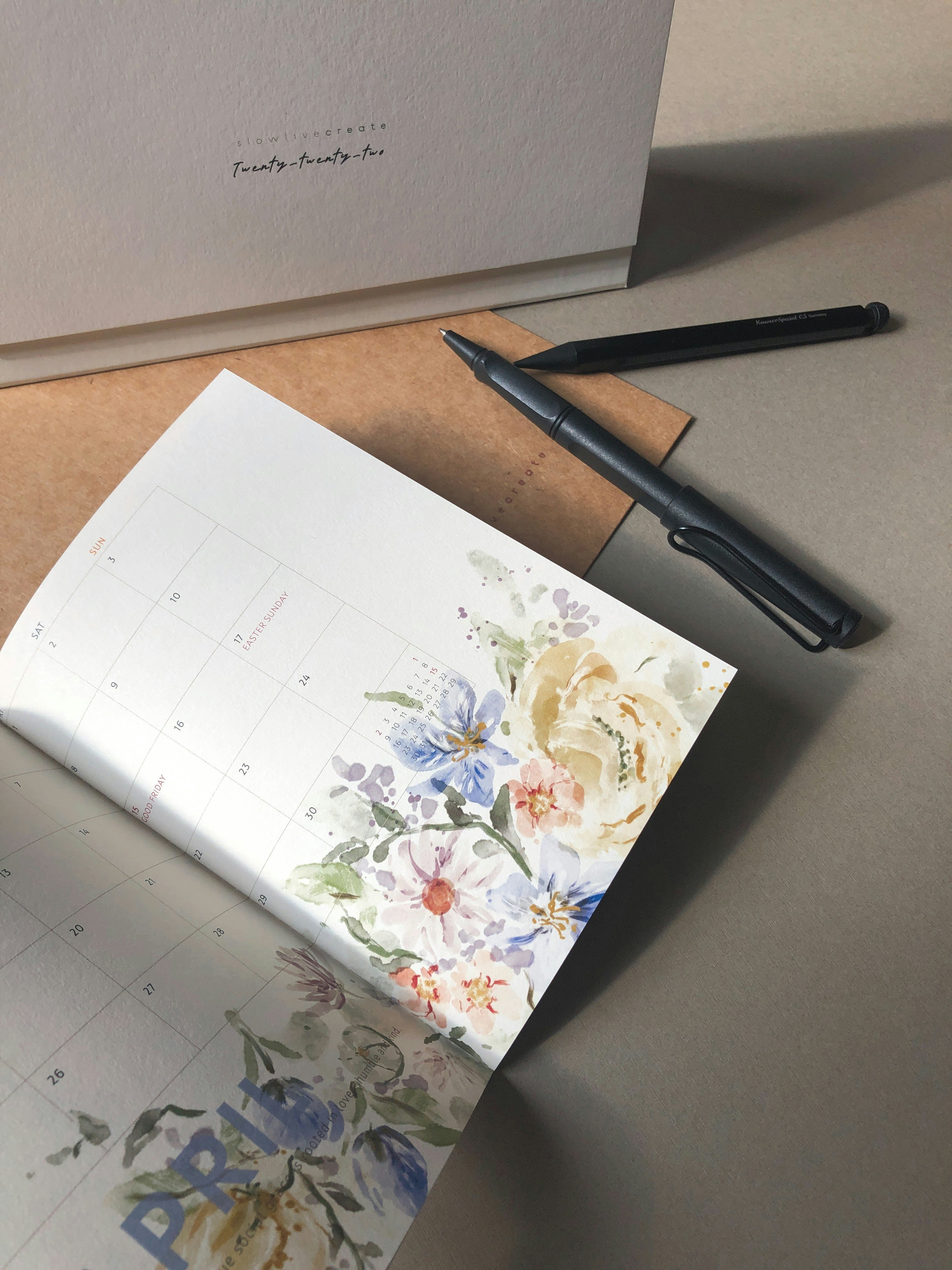 a pen and a paper on a table