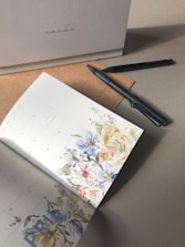 a pen and a paper on a table