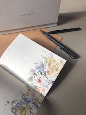 a pen and a paper on a table