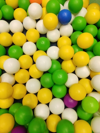 A collection of colorful stress balls in different shapes and sizes.