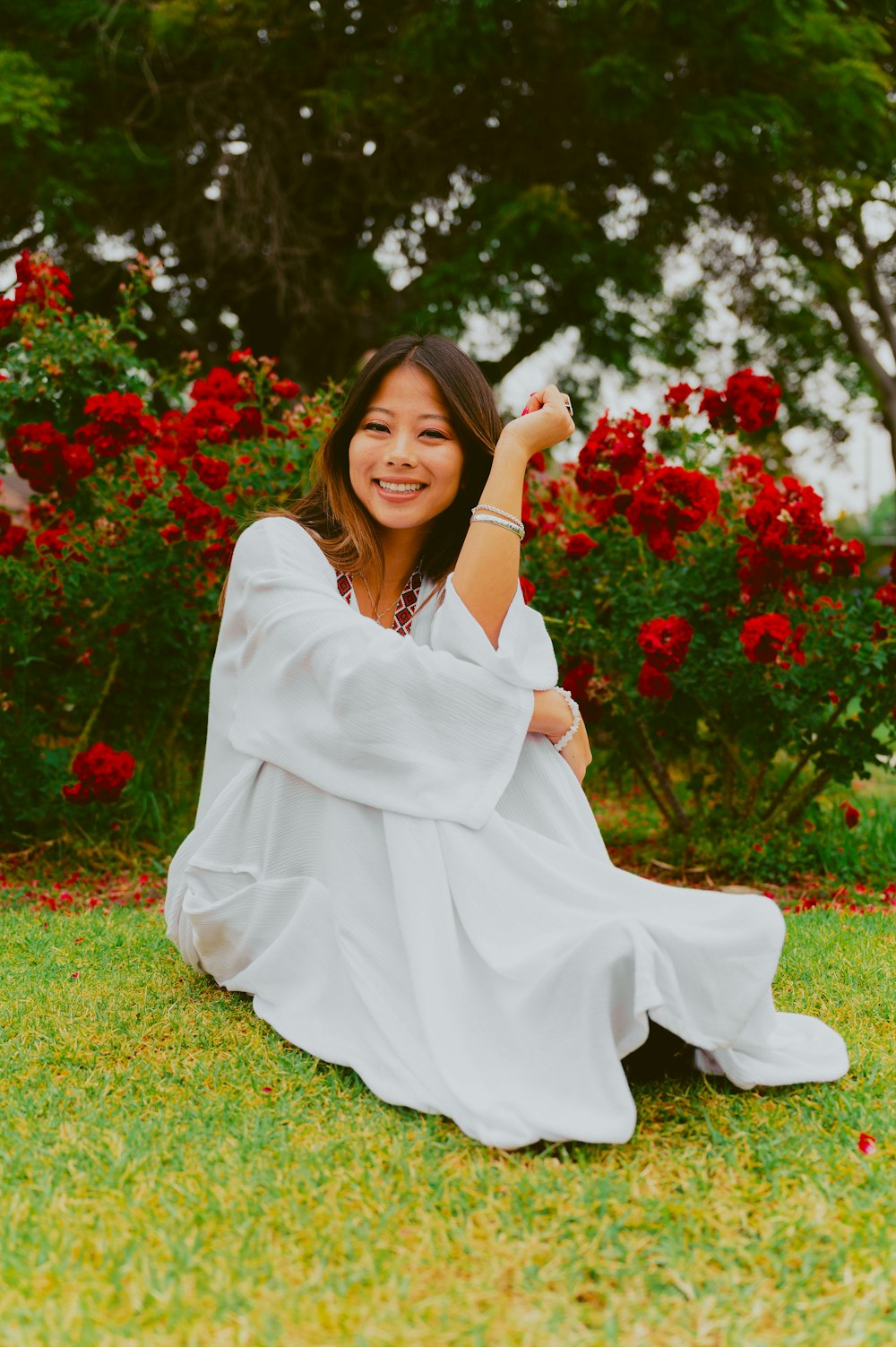 a person sitting on grass posing for the camera