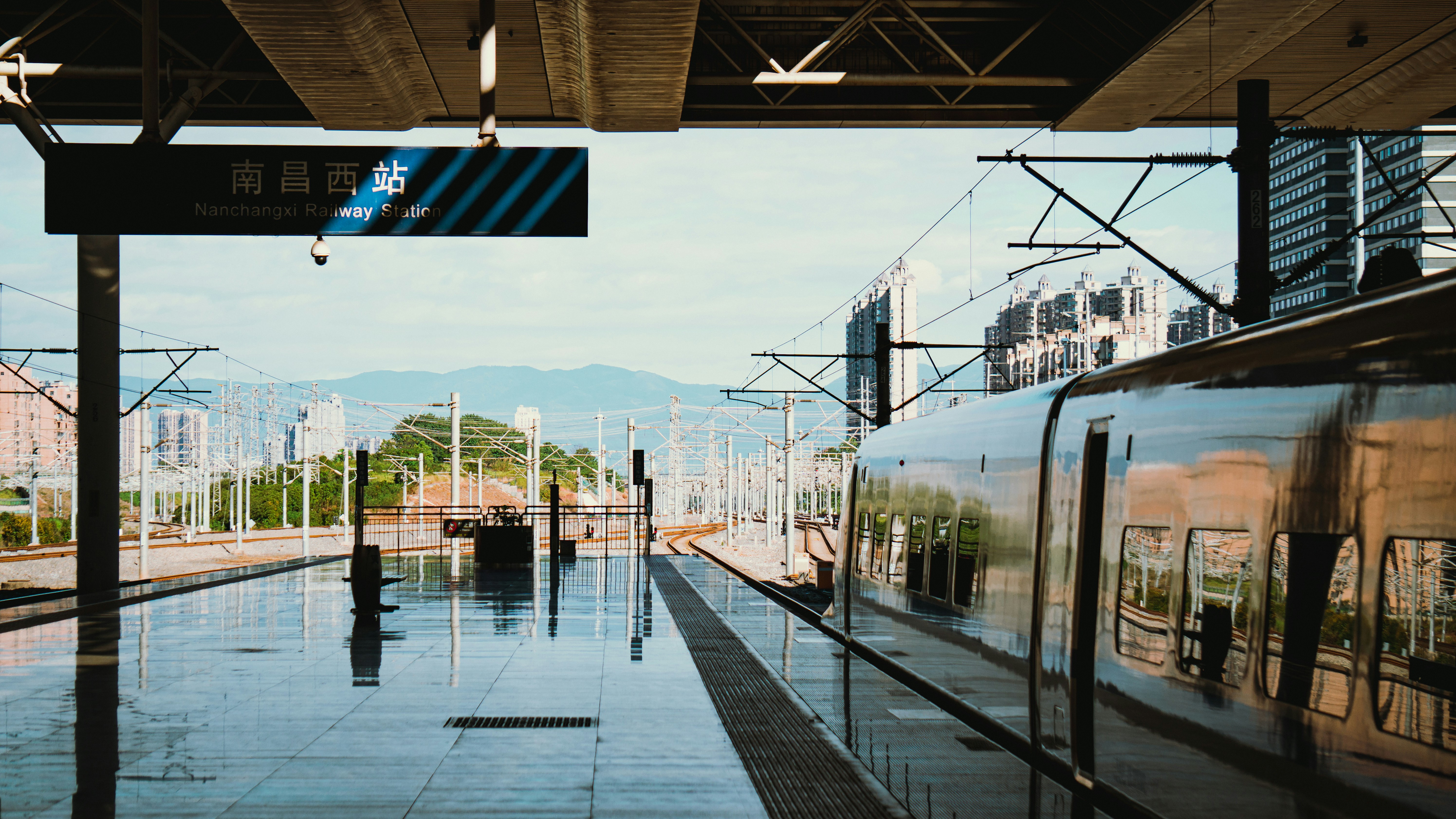 A modern, clean train standing at a platform, ready for departure, symbolizing efficient travel