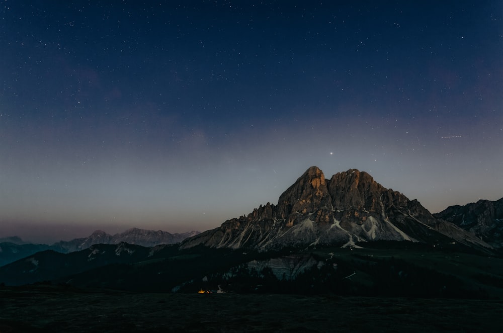 a body of water with mountains in the background