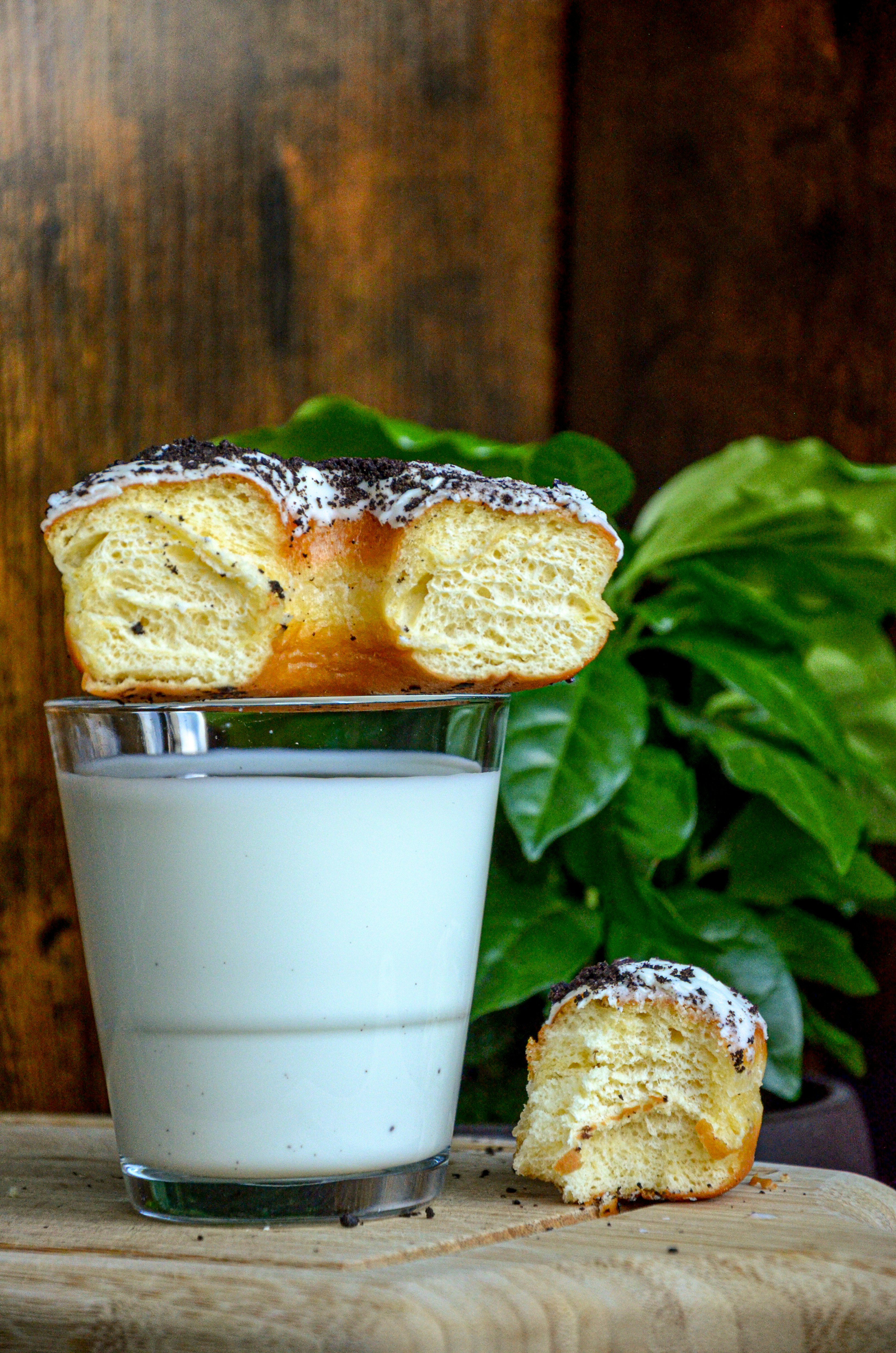 a glass of milk next to a plate of food