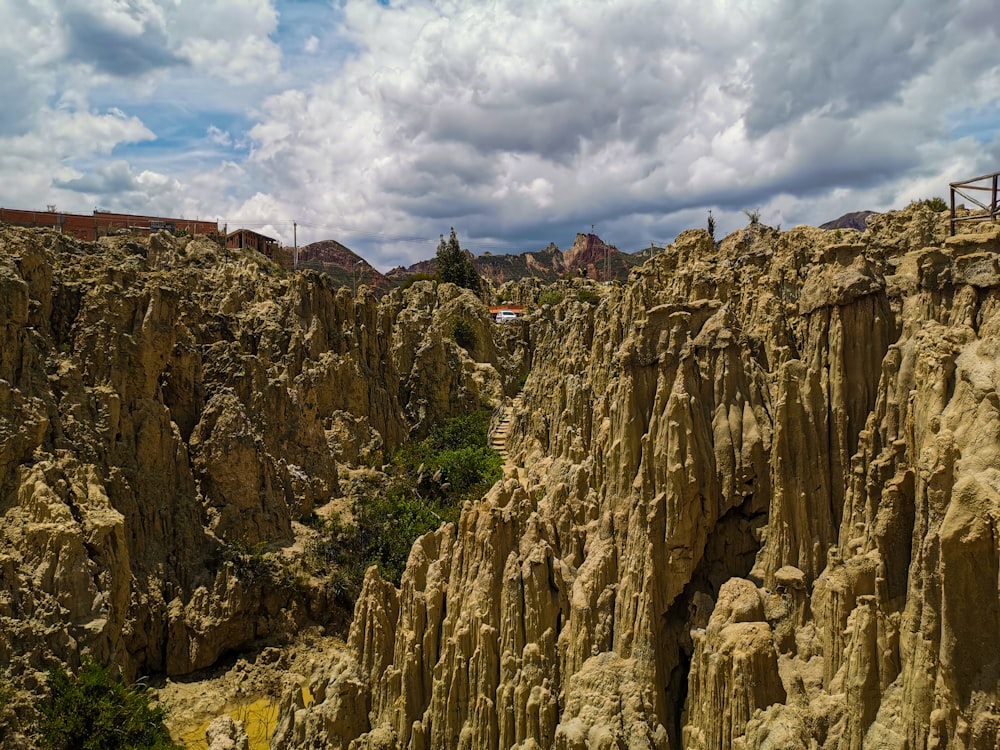 a rocky cliff with a building on it