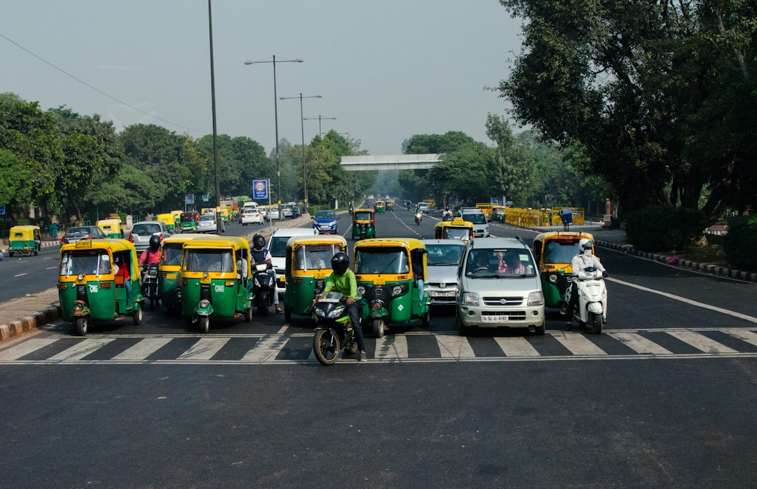 a group of vehicles are parked in a parking lot,