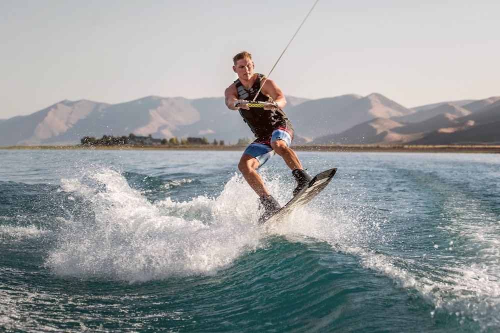 a man kite surfing on the sea