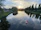 Couple on a boat during a serene river safari at sunset near Victoria Falls