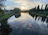 Couple on a boat during a serene river safari at sunset near Victoria Falls