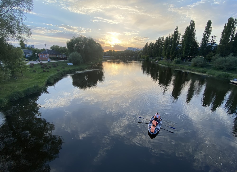 a group of people on a boat on a river