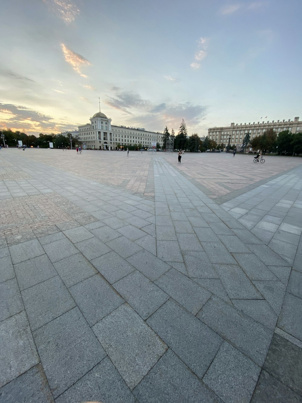 a large courtyard with people walking around