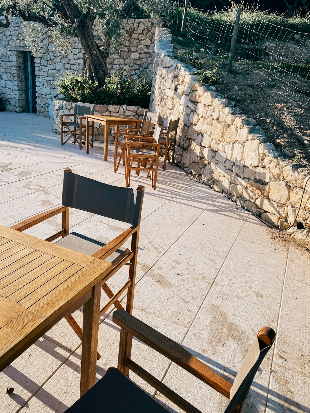 a group of tables and chairs outside