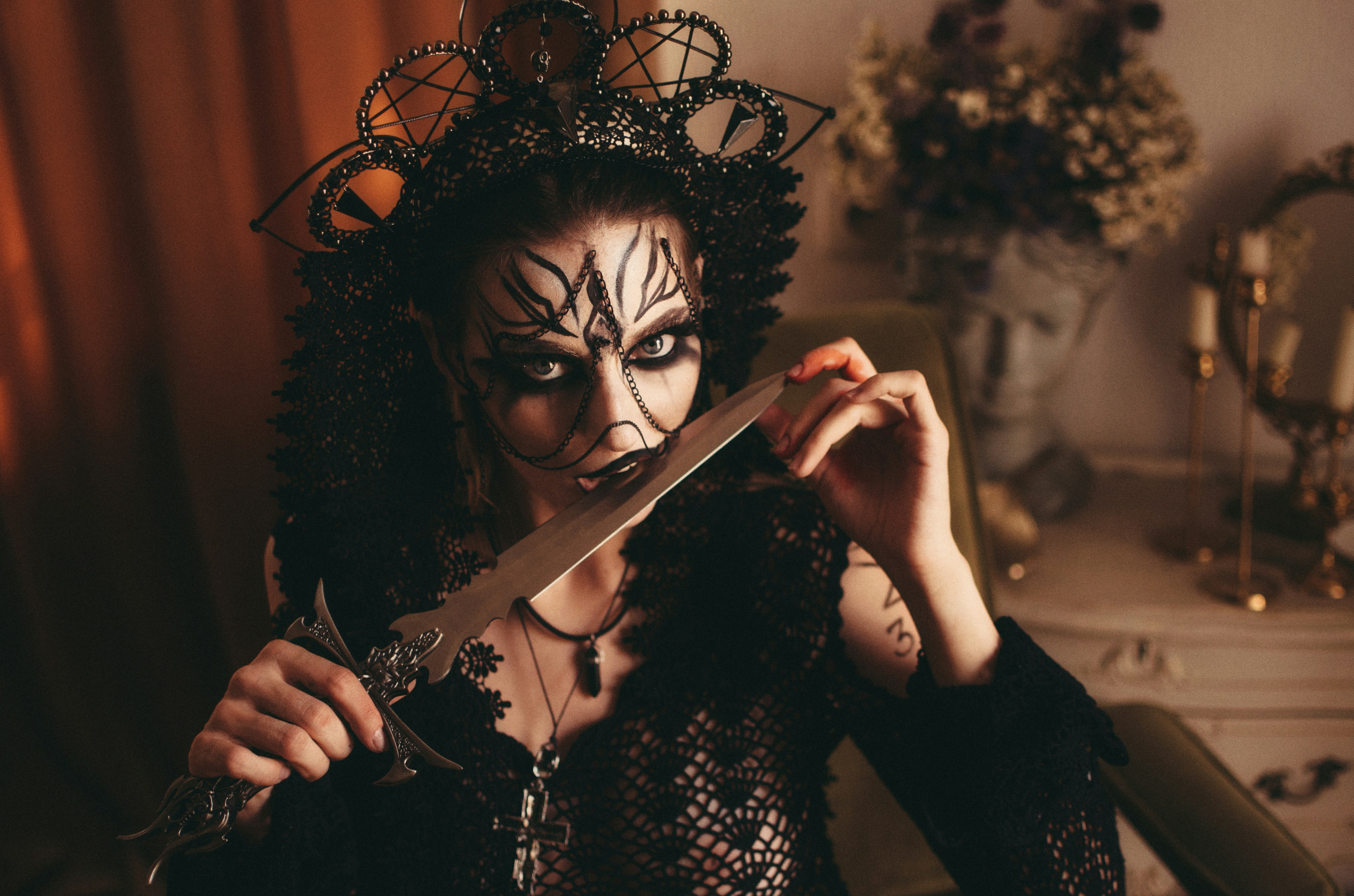 a woman with a mask and a sword