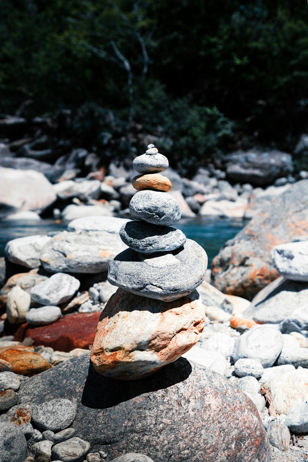 a stack of rocks on a river